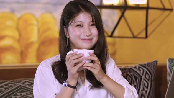 Beautiful Asian Girl Smiling With Coffee