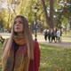 Woman Is Looking At The Sky In Autumn Park - VideoHive Item for Sale