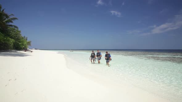 Divers Walking on Island