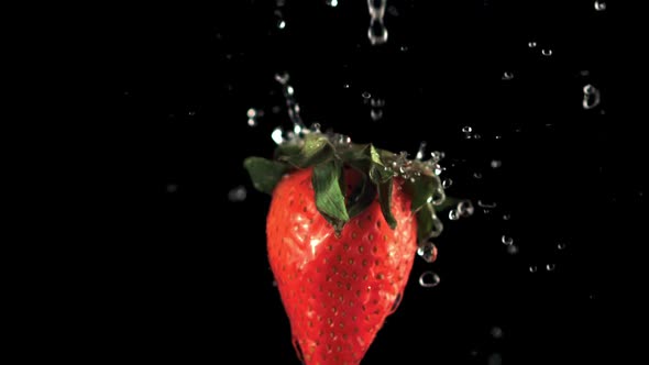 Super Slow Motion on Fresh Strawberries Drop Water Droplets