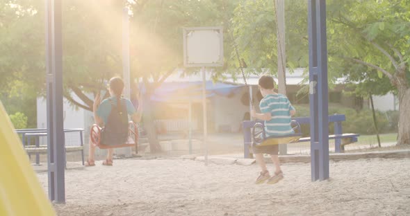 empty swings in a playground