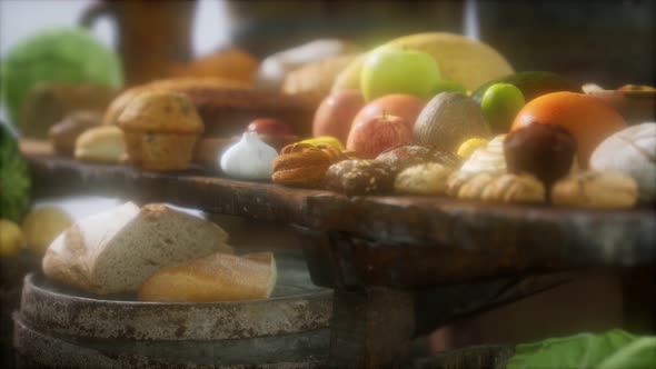 Food Table with Wine Barrels and Some Fruits, Vegetables and Bread