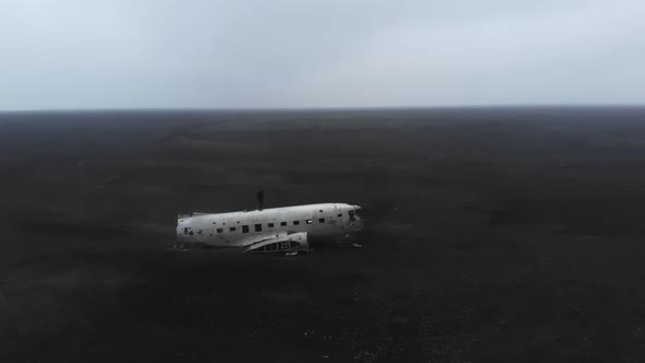 a plane that crashed on black sand