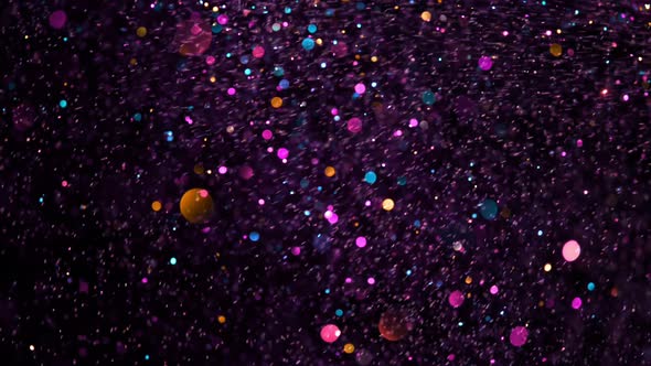 Super Slow Motion Shot of Colored Glitter Background