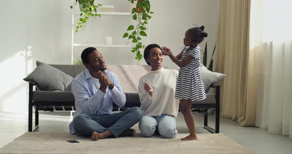 Afro American Beloved Daughter Preschool Girl Sings Song for Parents Shows Jaw Doing Movements Young