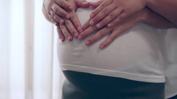 Pregnant Couple Feels Love and Relax at Home