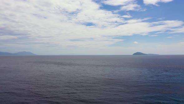 Seascape with Islands in the Distance. Blue Sea and Sky with Clouds, View From the Drone.