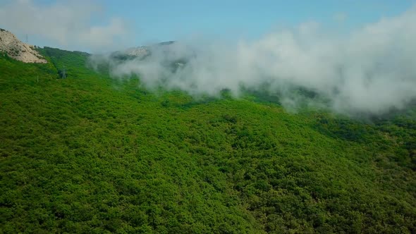 Aerial View of Lush Green Rain Cloud Cover Rain Forest Mountain During the Rainy Season in the
