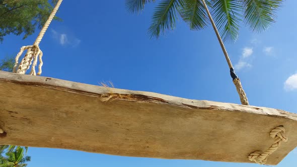 Tropical overhead tourism shot of a white sand paradise beach and blue water background in hi res 4K