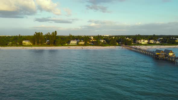 Naples Beach and Fishing Pier at Sunset, Florida.