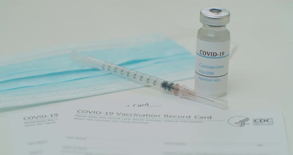 Medical Mask and COVID19 Vaccine on Vaccination Record Card Approved By CDC with Corona Virus