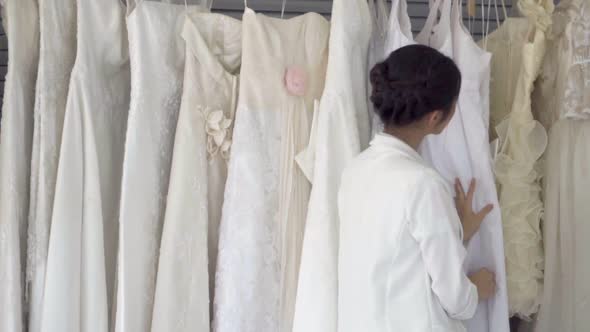 Future Bride Choosing Wedding Dress for Her Upcoming Wedding Ceremony