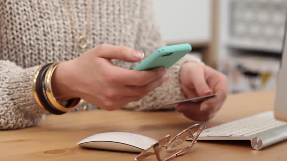 Young Woman Buys Online Using her Phone