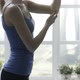 Fit woman doing stretching exercises at home - VideoHive Item for Sale