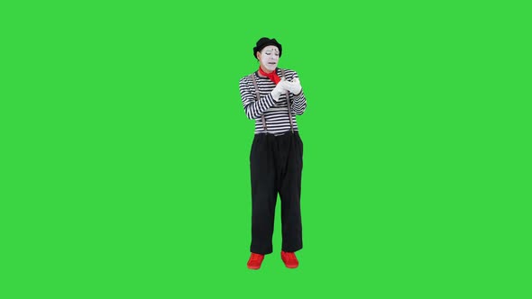 Funny Mime Using Imaginary Smartphone on a Green Screen Chroma Key