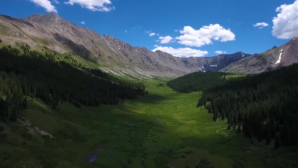 AERIAL: Drone pushing into a mountain valley in Colorado.