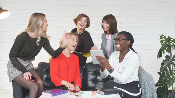 Skilled Multicultural Female Bloggers Discussing New Themes for Media Web Page.