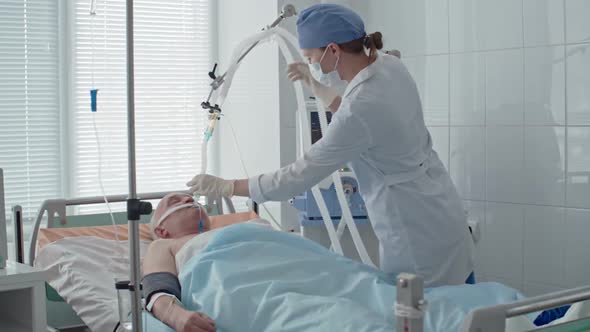 Nurse Caring for Elderly Patient in ICU