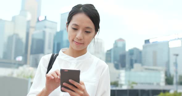 Business Woman Use of Mobile Phone in City