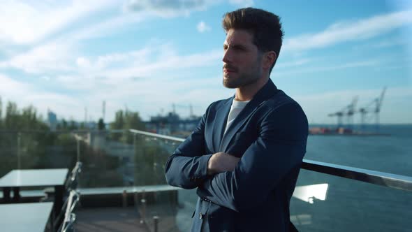 Handsome Businessman Morning Sunlight Rest on Glass Terrace at Sea Cranes View