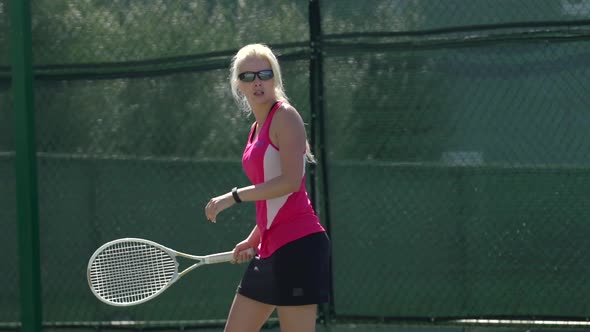 Women playing tennis.