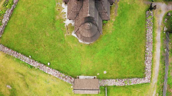 Aerial View Of The Gol Stave Church On The Lush Field In Oslo, Norway - top-down shot