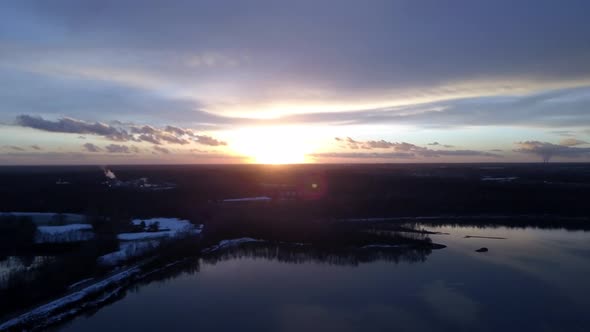 Beautiful Forest Lake Sunset Aerial with Vibrant Fall Season Colors Establishing Panning Shot