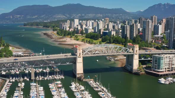 Moored Boats At Marina By False Creek With Vehicles Driving At  Burrard Bridge - Sunset Beach, Park