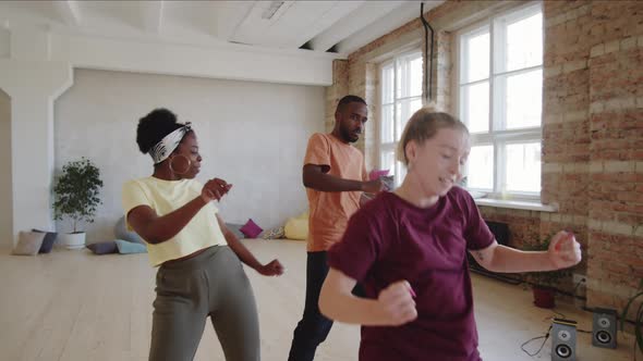 Afro Couple Having Private Dance Lesson with Female Instructor