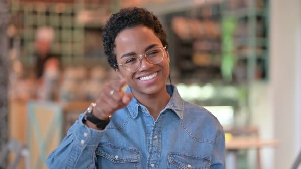 Portrait of Cheerful African Woman with Pointing with Finger