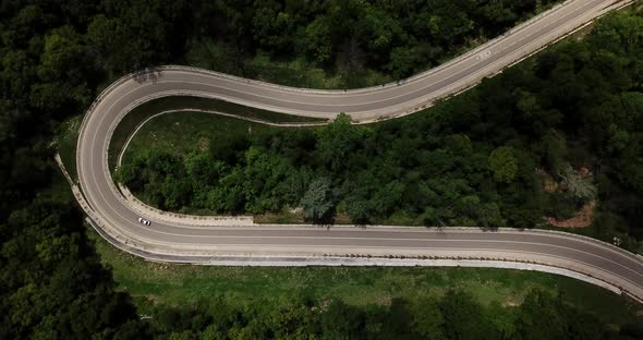 Aerial View From Drone of Curve Road with a Car on the Mountain with Green Forest in Russia