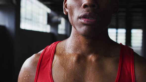 Portrait of african american man breathing heavily after a run in an empty building