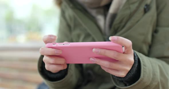 Woman use of mobile phone in the park