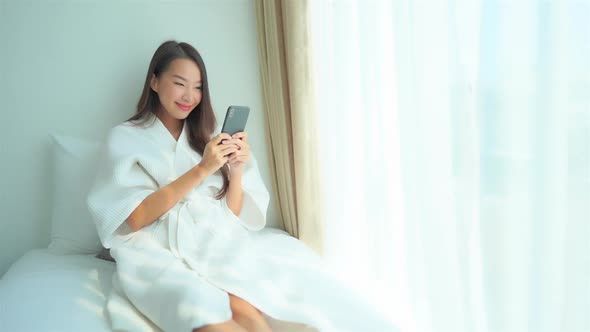 Young asian woman use smart phone