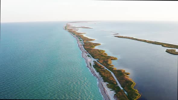 Aerial Panoramic Landscape View of Beautiful Spit in Crimea in Black Sea During the Day in Sunny