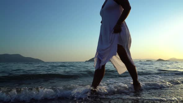 Woman Feet Walking The Beach 