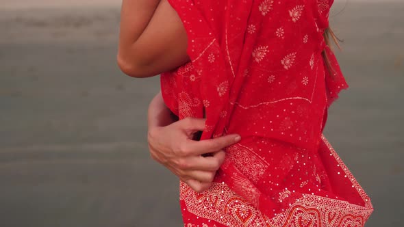 Young Women Wearing a Red Saree on the Beach Goa India