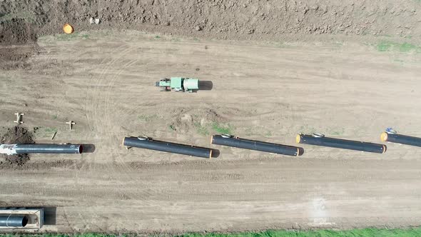 Aerial view of gas and oil pipeline construction. Pipes welded together.