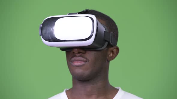 Young African Man Using Virtual Reality Headset