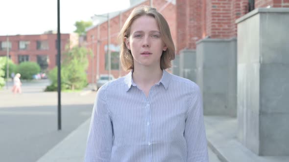 Casual Woman Walking on the Streetooking at Camera