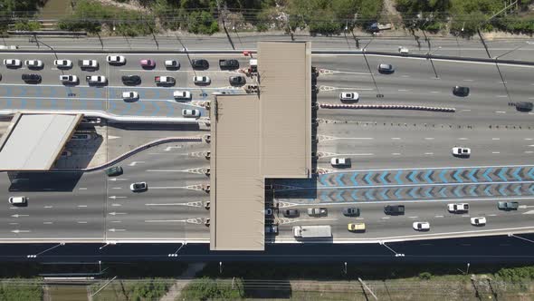 Aerial top down view Cars passing Toll gateway on Highway multi lane road.