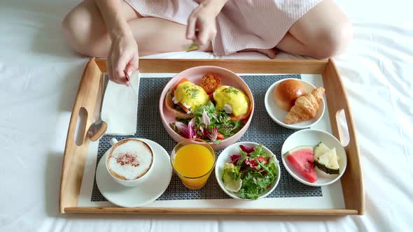 Breakfast in Bed  Woman Hand Takes Cutlery Rotate Bowl and Preparing to Eat