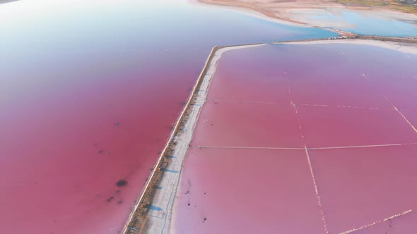 Wonderful Flight Over a Pink Salty Lake at Sunset in the Evening