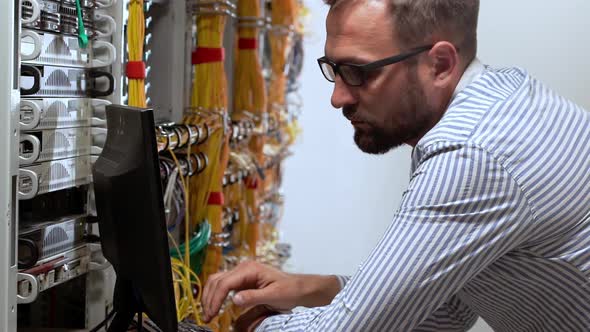 Engineer Working in Data Room