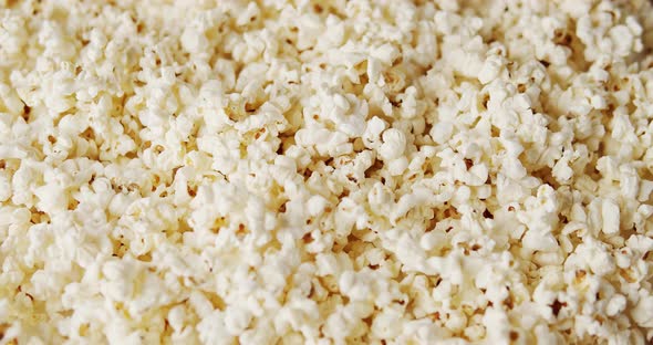Delicious Popcorn on a Rotating Background