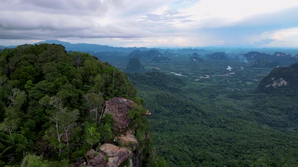 Dragon Crest Rock in the Jungle of Krabi Thailand Couple Men and Woman Looking Out Over Jungle