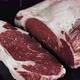 Raw Marbled Ribeye Beef Steak Sprinkled with Salt on Black Tabletop - VideoHive Item for Sale