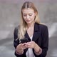 Blond Businesswoman Browsing Cellphone During Break - VideoHive Item for Sale