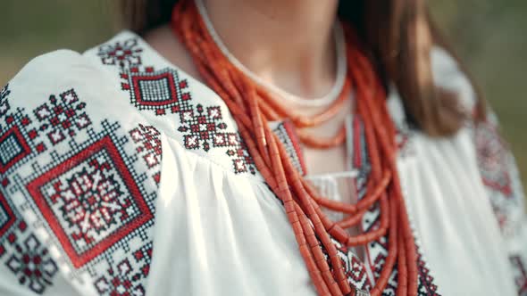 Ukrainian Woman in Embroidery Vyshyvanka Dress and Ancient Coral Beads