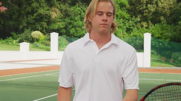 Tennis player rotating his racket